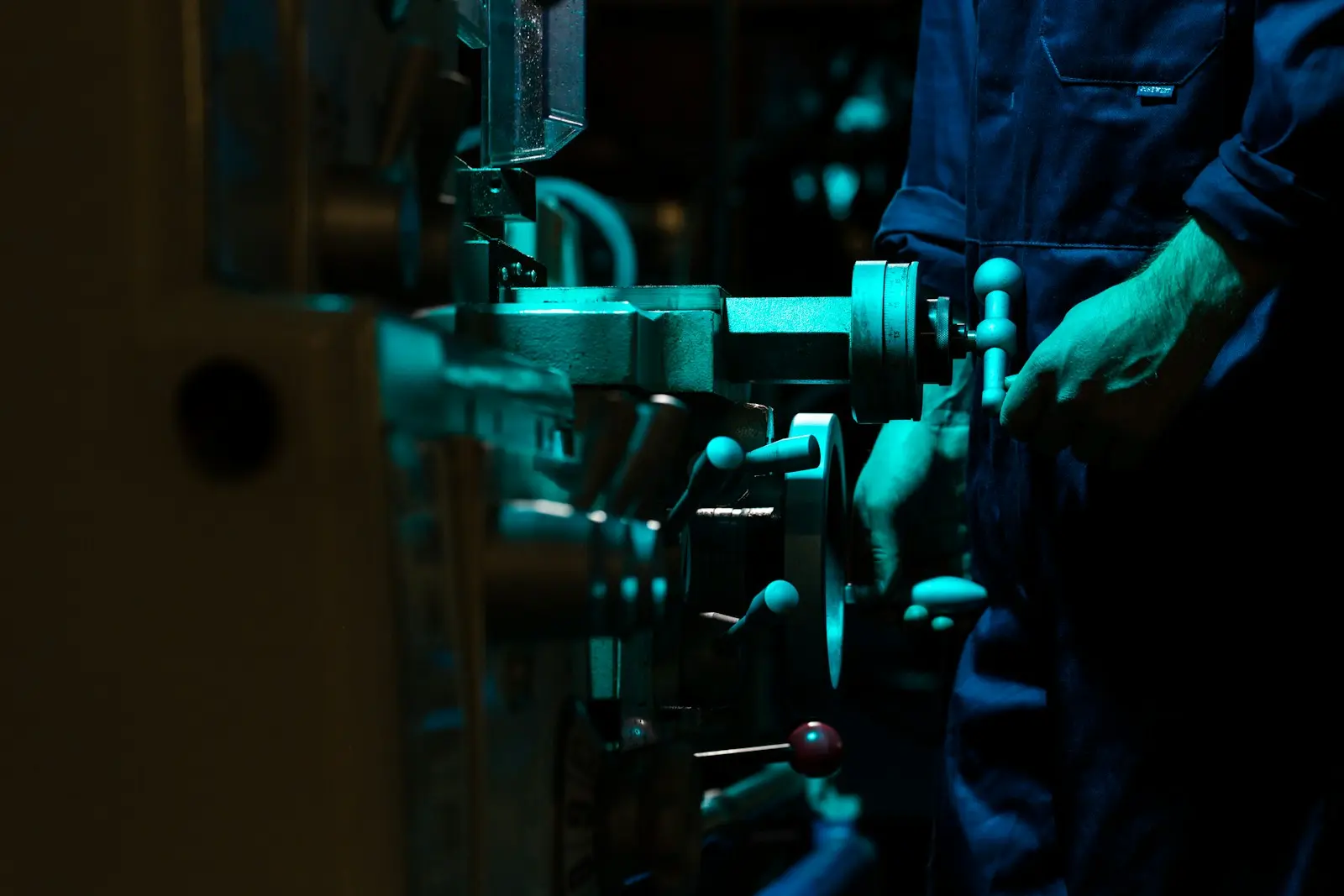 Technician operating precision industrial machinery