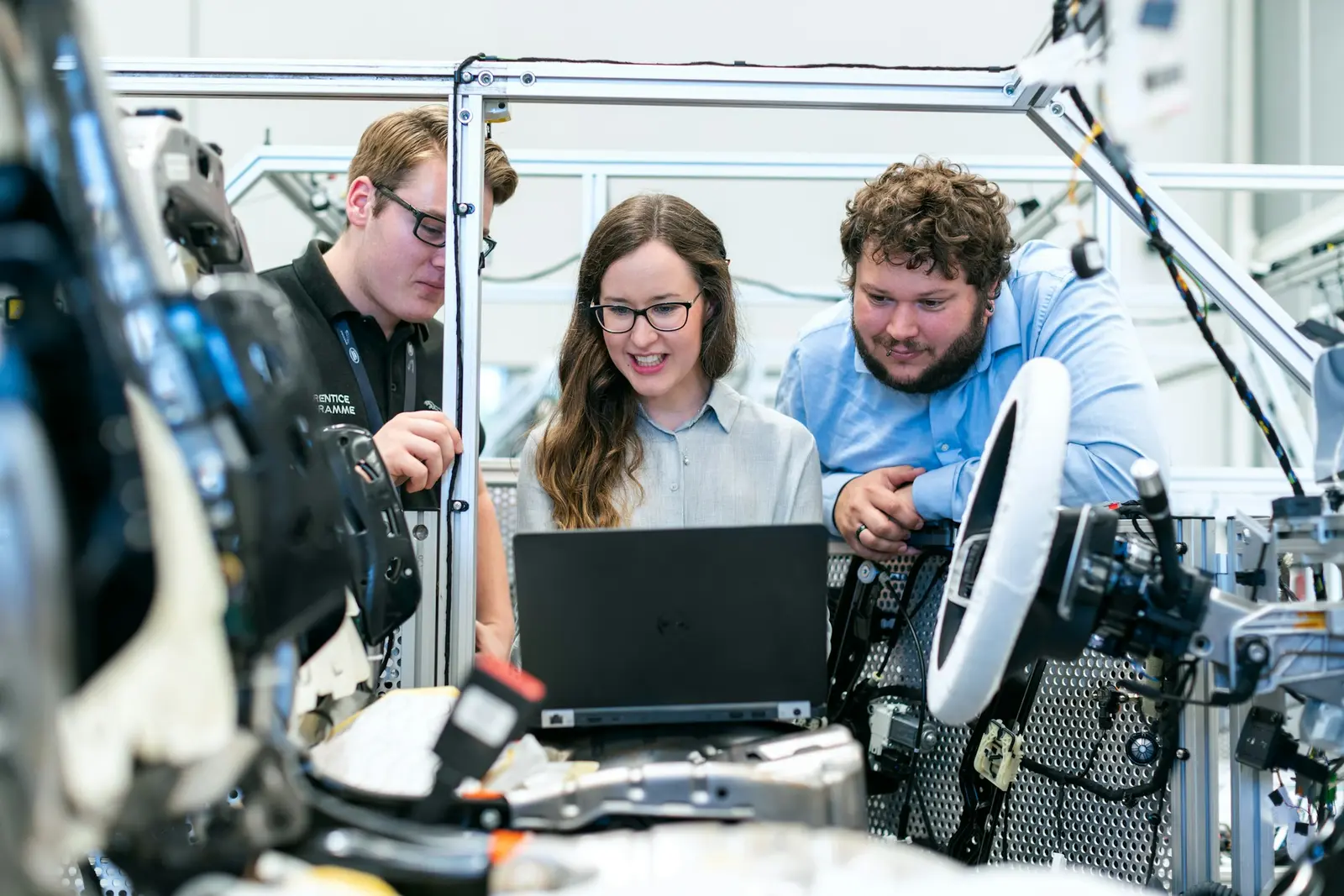 Engineers reviewing technical work at a laptop